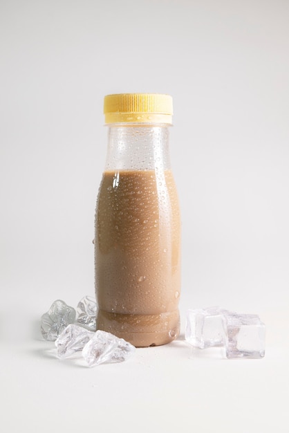 Cold coffee in bottle with ice