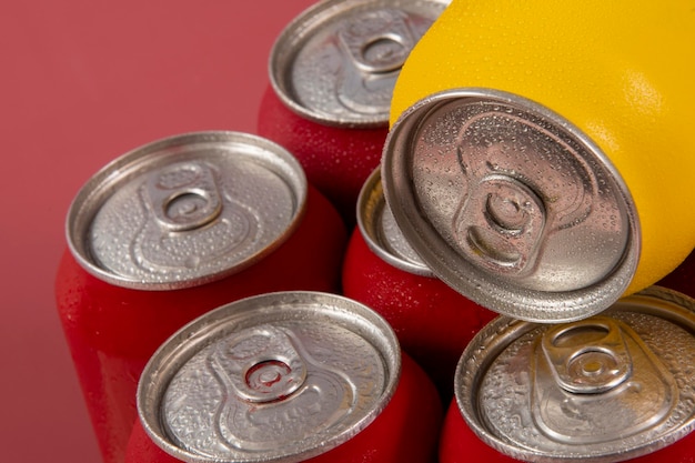 Cold red soda cans with a yellow one for conceptual use