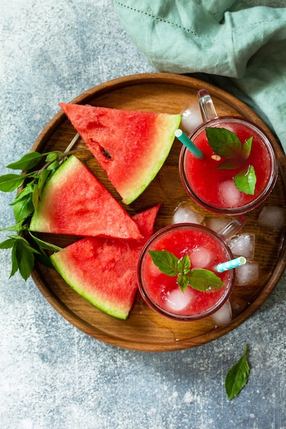 Cold Watermelon Smoothie Summer Watermelon drink and slices of watermelon Top view Copy space