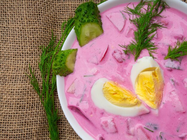 Cold young beetroot soup Traditional ukrainian russian polish beet soup Cold borscht served with cucumbers and eggs