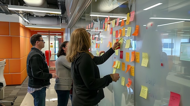 Collaborative Brainstorming Session with Sticky Notes on Glass WallTeam Members Actively Sharing Ideas and Building on Each Other39s Thoughts