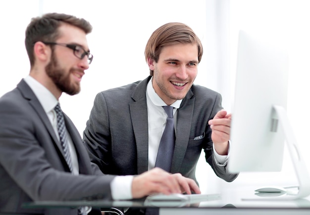 Colleagues are discussing new data sitting at a Desk