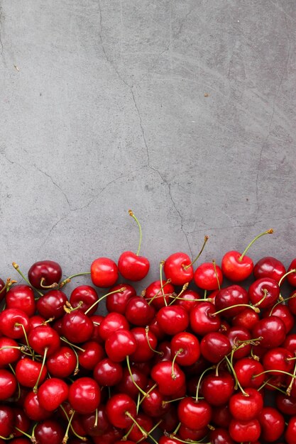 Collecting cherries in the garden The boxes are freshly picked red cherries Industrial cherry