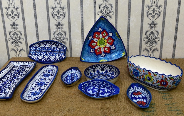 Photo a collection of blue and white pottery from the collection of the persian style.