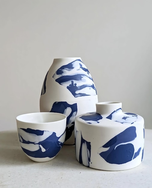 A collection of blue and white vases with a white background.