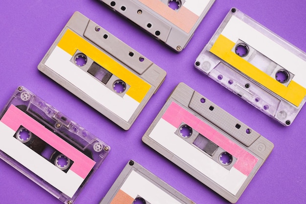 Collection of cassette tapes on purple background