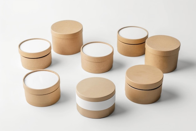 Collection of ecofriendly round kraft boxes for storage or gifts on a clean white surface