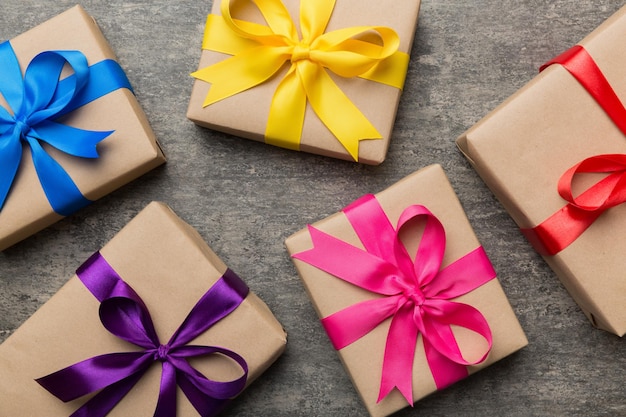 Collection of Holiday present boxes on a colored background top view close up