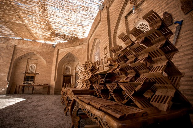 The collection of Koran stands in a wood carving workshop