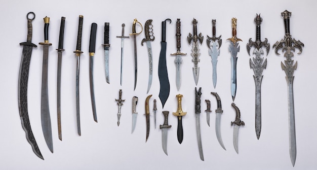 collection of medieval swords knives and daggers