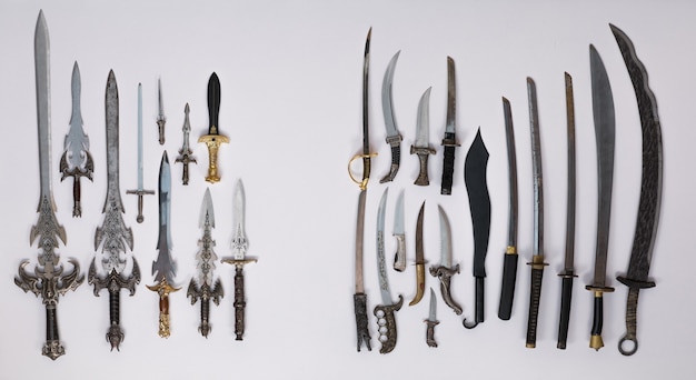 collection of medieval swords knives and daggers