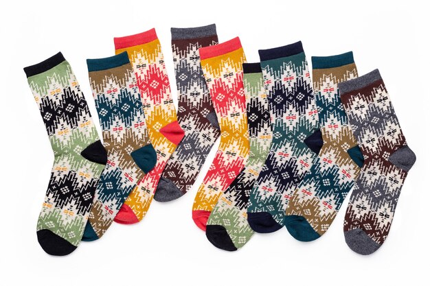 Collection of multicolored knitted socks with bright festive ornament