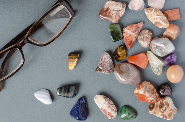 Collection of precious stones on a gray background