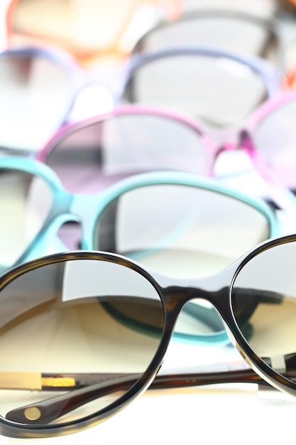 Collection of sunglasses on white background