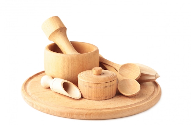 Collection of wooden kitchen utensils isolated on white.