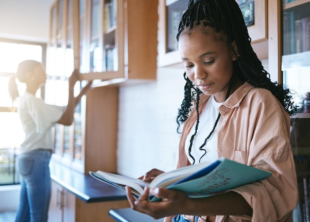 College student black woman library and reading books for education learning and academic knowledge in Brazil Young african studying exam research project and information at university bookshelf