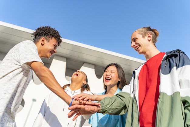 College student teamwork stacking diverse hand togetherness concept