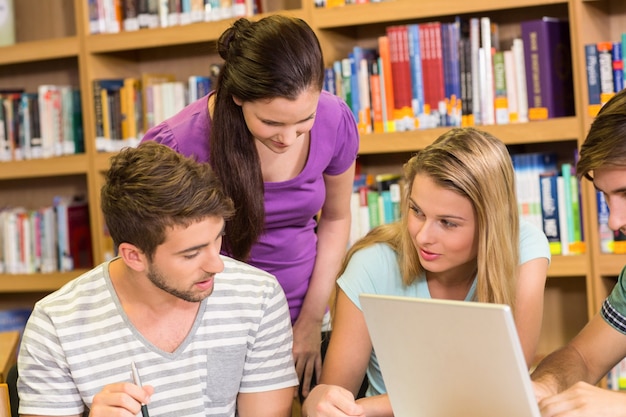 College students doing homework in library