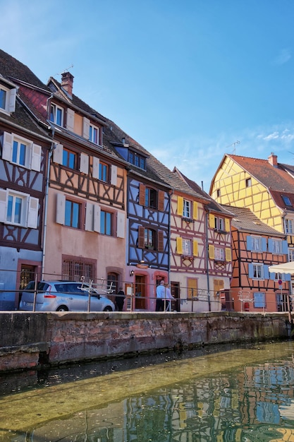 Colmar, France - May 1, 2012: Little Venice quarter and River Auch in Colmar, Haut Rhin in Alsace, France. People on the background