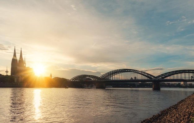 COLOGNE embankment of Rhine on background of Cologne Cathedral and Hohenzollern Bridge