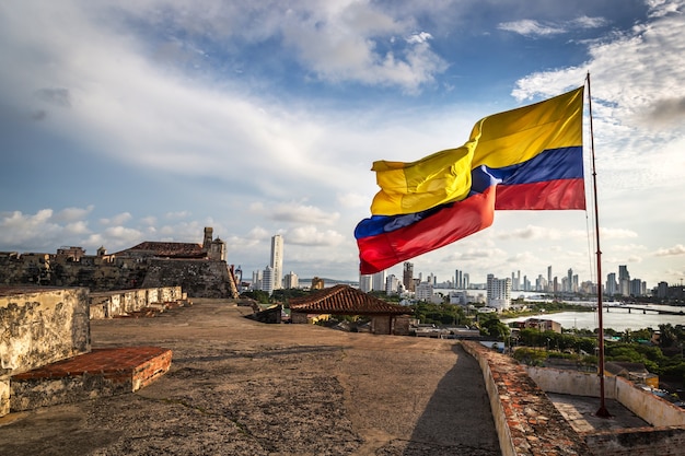 The Colombian flag in the Cartagena Fort in a cloudy and windy day. Cartagena, Colombia