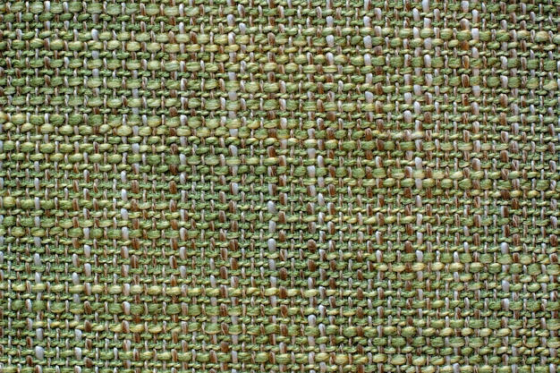 Color fabric texture. Woolen soft crumpled fabric of a green shade.