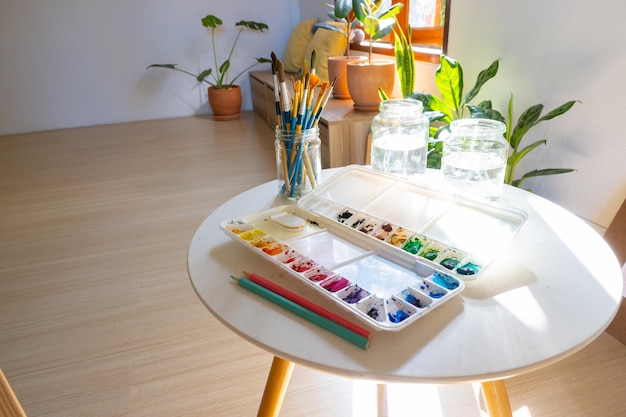 The color palette brush and water bottle put in the art studio room