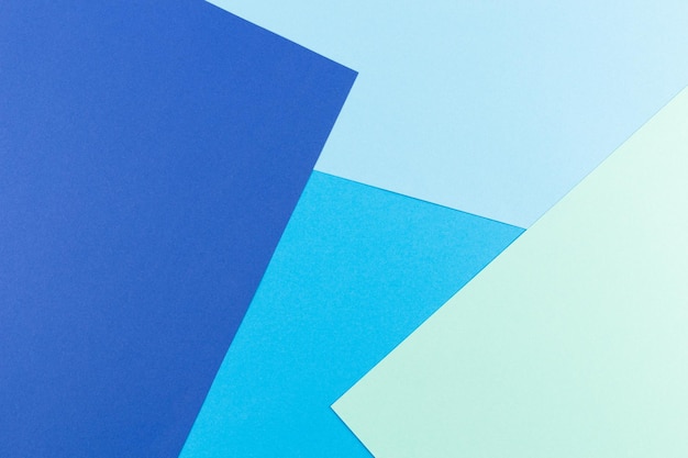 Color papers geometry flat lay composition background with blue tones