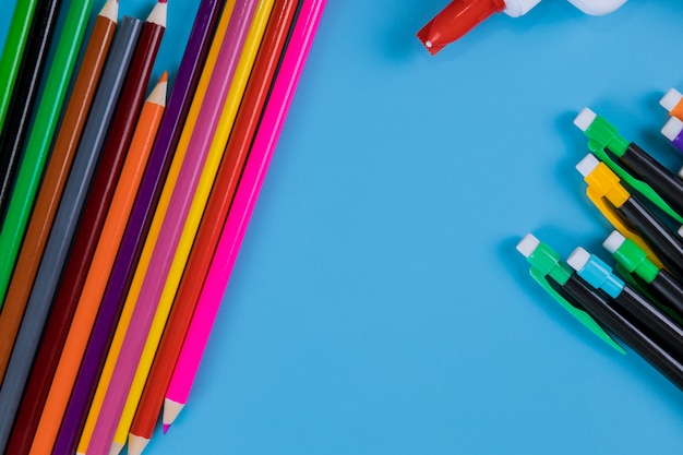 Color pencil isolated on blue background, education art concept.