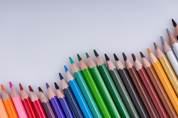 Color Pencils placed on a white background