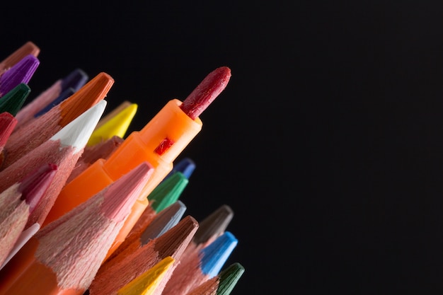 Color Pencils success creative concept On Black Background Close-up.	