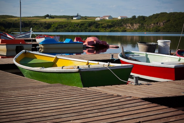 Color Wooden Boats with Paddles in a Lake