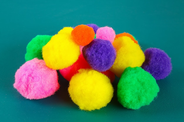 Colored beautiful pompons. Assortment of pompons.