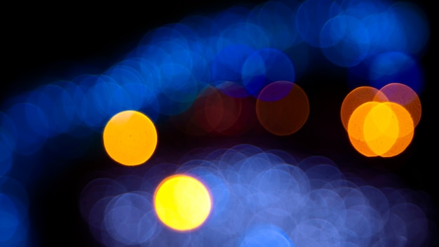 Photo colored blurred bokeh. abstract background of included festive garlands. colorful blur light bulbs