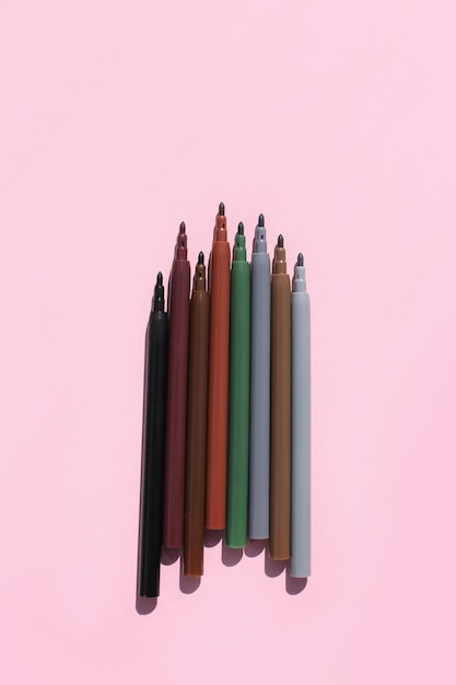 Colored bright stylish felttip pens on a bright colored background