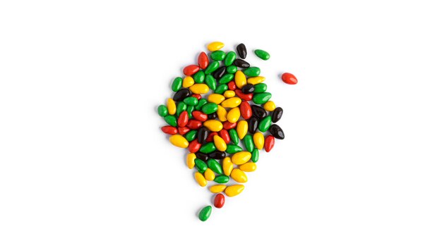 Colored chocolate sunflower seeds isolated.