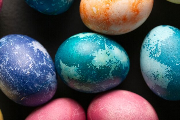 Colored Easter eggs on a dark background Christian Easter