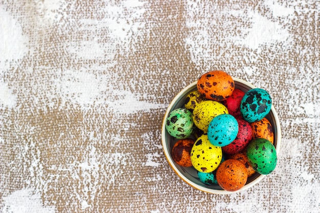 Colored easter eggs on a light canvas background