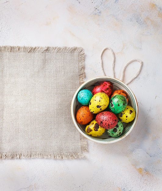 Colored easter eggs on a light canvas background