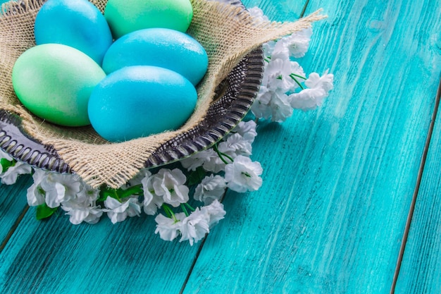 Colored eggs on a wooden background