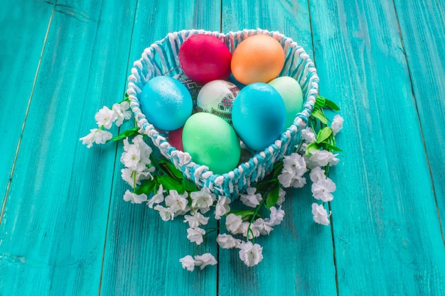 Colored eggs on a wooden background