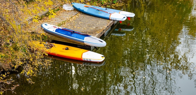 Colored kayaks near the pier.