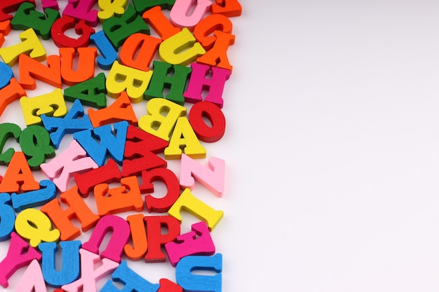 Colored letters close up which symbolize knowledge and learning copy space