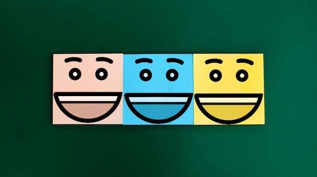 colored paper with three happy faces Business service rating concept joy in something Service sup