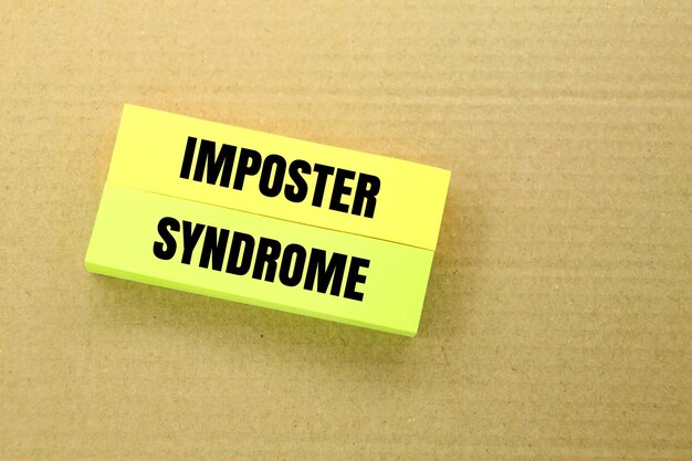 colored paper with the word Imposter Syndrome disease or medical concept