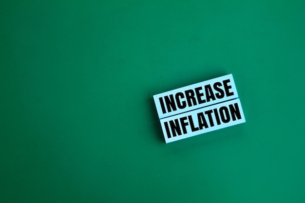 colored paper with the word increase inflation business or investment concept