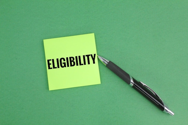 colored pen and paper with the word Eligibility. having the right to do or obtain something