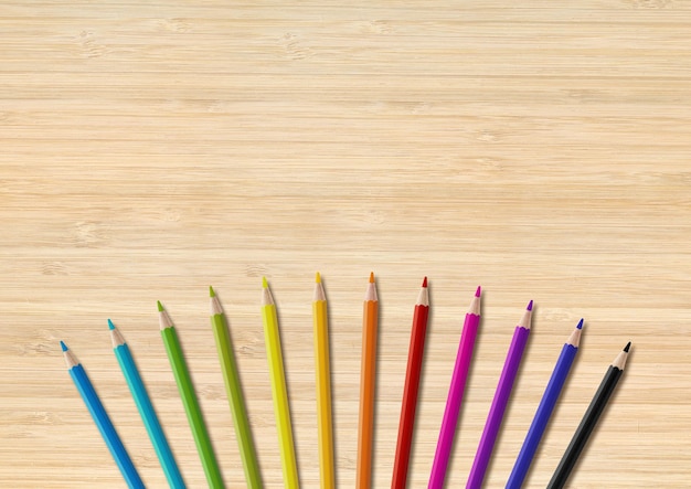 Colored pencil group isolated on wooden background Horizontal background