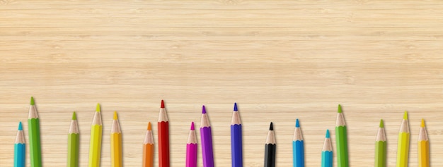 Colored pencil group isolated on wooden background Panoramic banner background