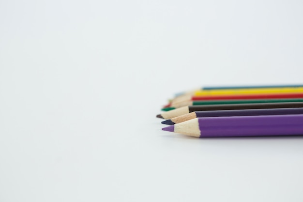 Colored pencils arranged in a row